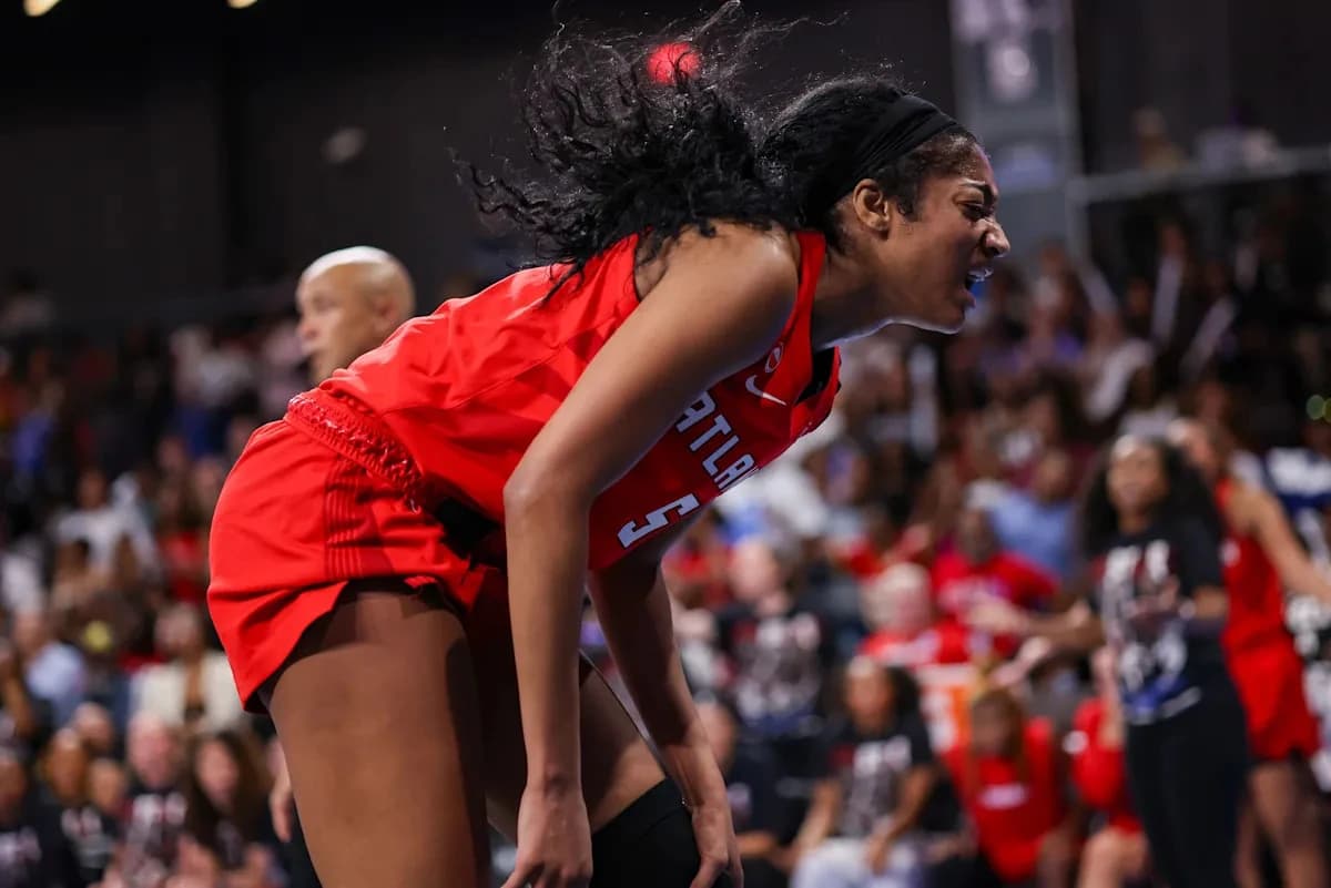 Angel Reese exits Dream win over Sky with potential knee injury