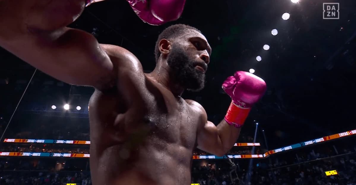 Boots Ennis stops Xander Zayas in 7th round to win WBA and WBO titles