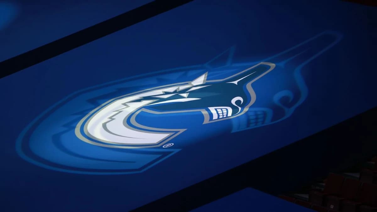 Canucks name Johnson GM, Sedins co-presidents