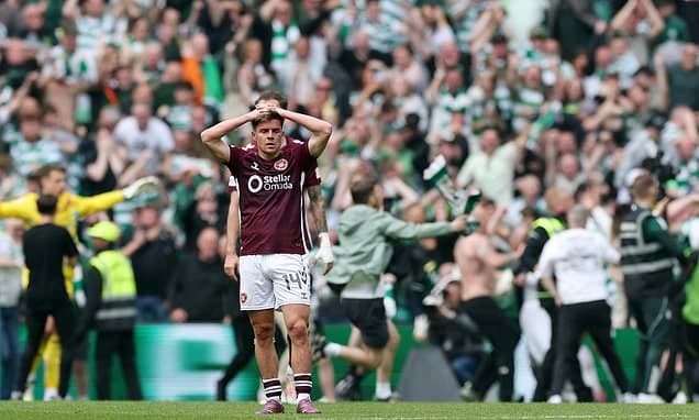 Celtic fans ATTACK Hearts players during wild pitch invasion after winning the league - with skipper