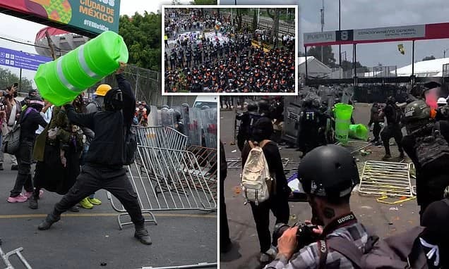 Chaos erupts outside Mexico City World Cup stadium as protesters fight with riot police and man suff