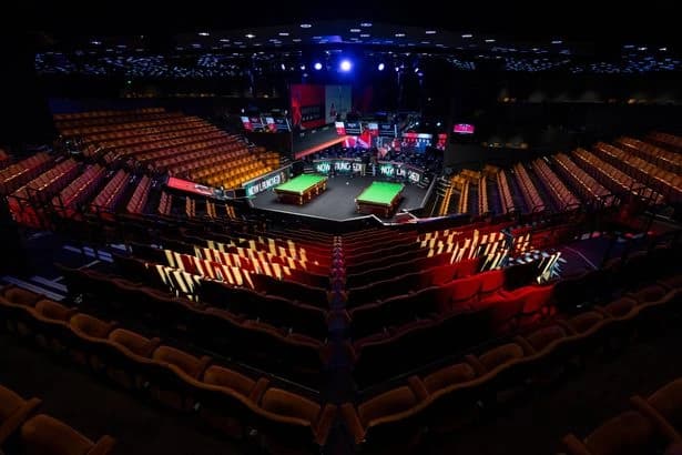 Crucible snooker match halted as players forced to compete behind closed doors