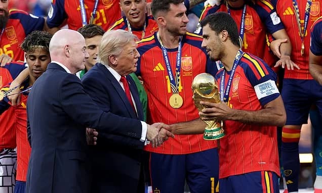 Donald Trump ignores FIFA president's call to leave the stage as he joins Spain's World Cup final tr