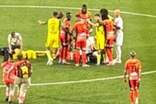 Ex-Arsenal star rushed to hospital with 'broken eye socket' as medics run to halt match