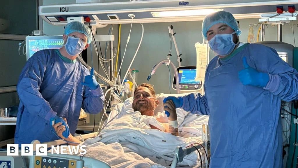 Ex-rugby player Rhys Thomas holds his own heart after transplant operation