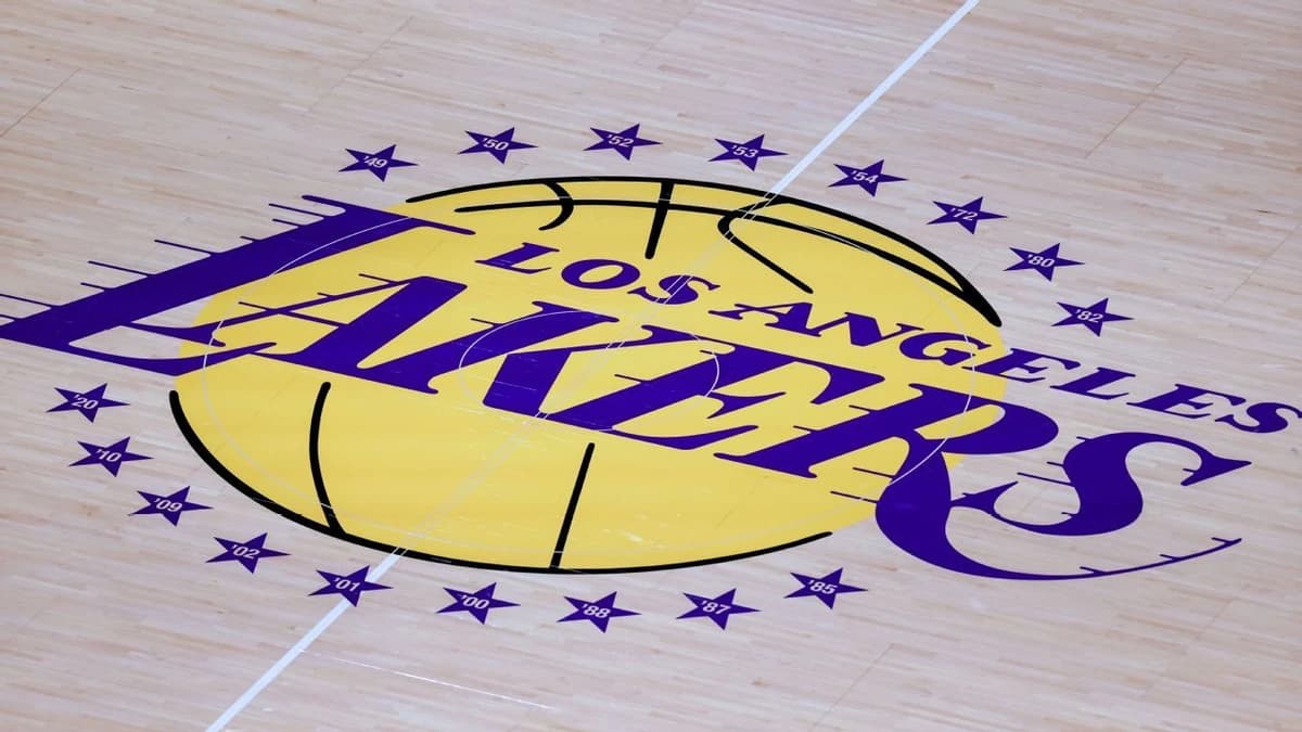 Jeanie contesting family's sale of stake in Lakers