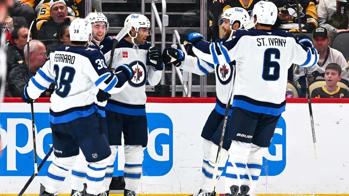 Jets surge with three goals in third period, hand Penguins first loss
