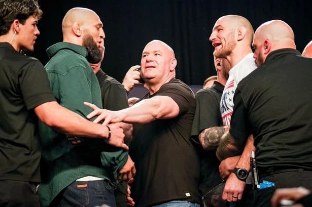 Khamzat Chimaev KICKS Sean Strickland as police intervene during heated face off