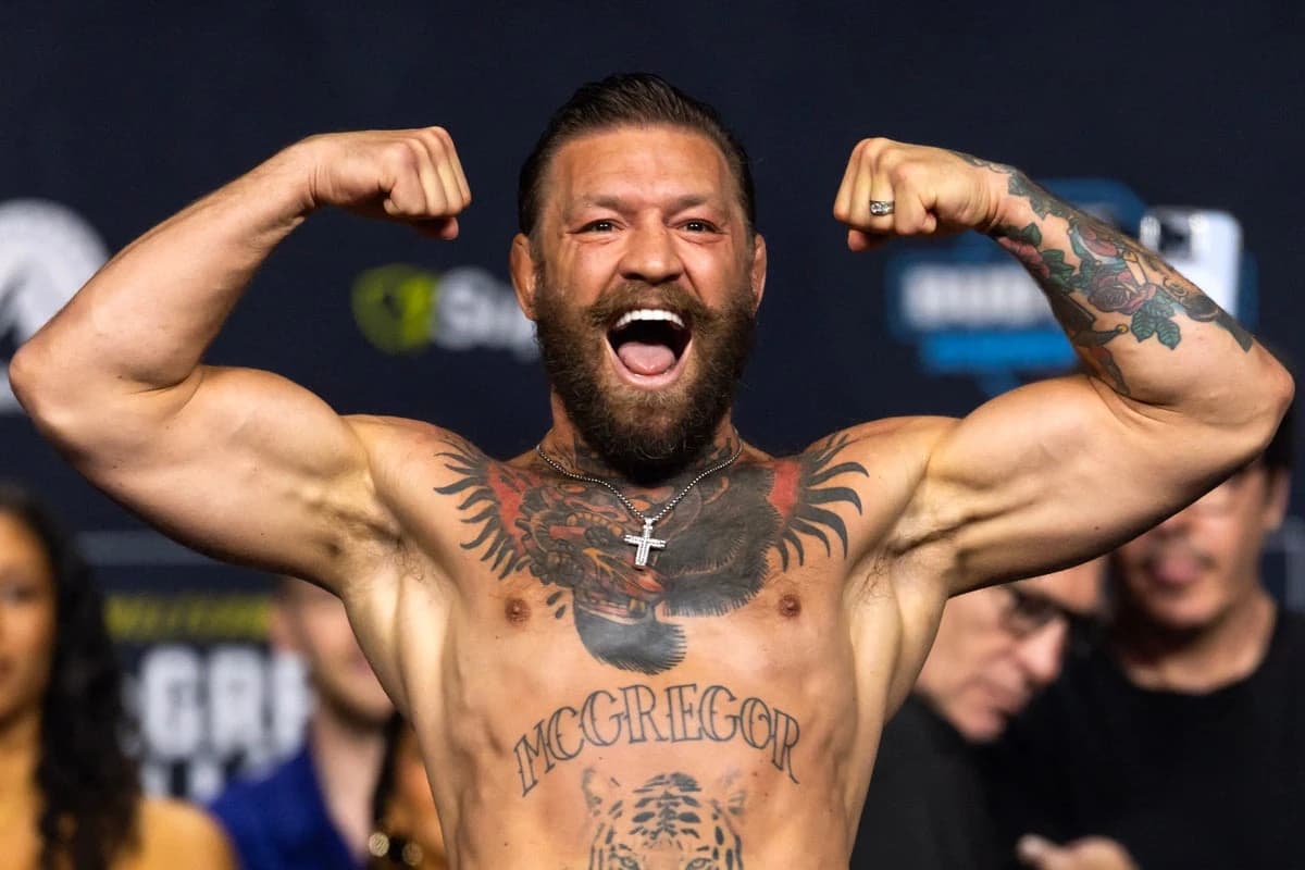 McGregor vs Holloway LIVE: ‘Notorious’ slaps rival after making weight for controversial UFC 329 fig