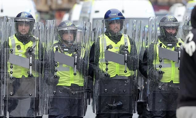 Police demand 'urgent' talks with Celtic after fans pelt cops with 'missiles and glass bottles' duri