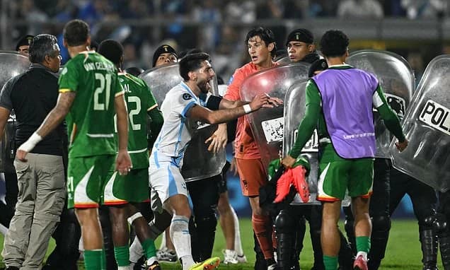 Riot police rush to stop mass brawl after Nations League clash descends into chaos - as Suriname mak