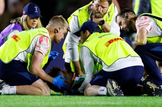 Rugby star knocked out one minute into his debut in worrying collision as medics rush to aid