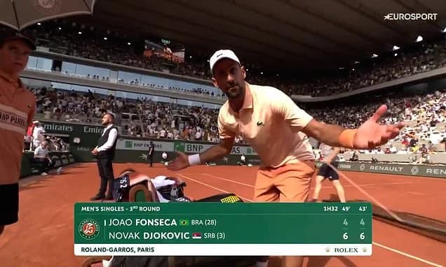 Sarcastic Novak Djokovic clashes with French Open cameraman in terse exchange before blowing two-set