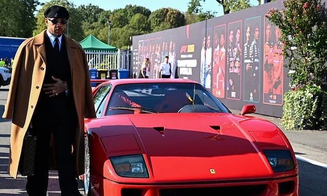 Sharp-suited Lewis Hamilton pledges to become first black man to win for Ferrari in Italy... as he d