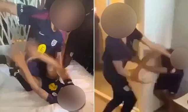 Shocking moment England youth stars scrap in wild hotel brawl as team-mates stand around laughing an