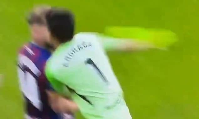 Shocking moment goalkeeper PUNCHES opposition player after being sent off, sparking huge on-pitch br