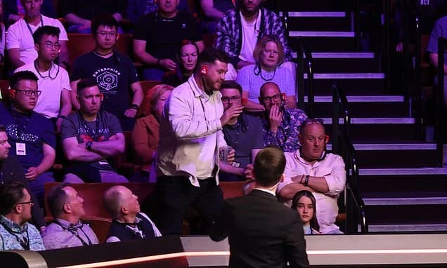 Snooker fan is THROWN OUT of World Championship semi-final for bizarre Epstein Files outburst in mor