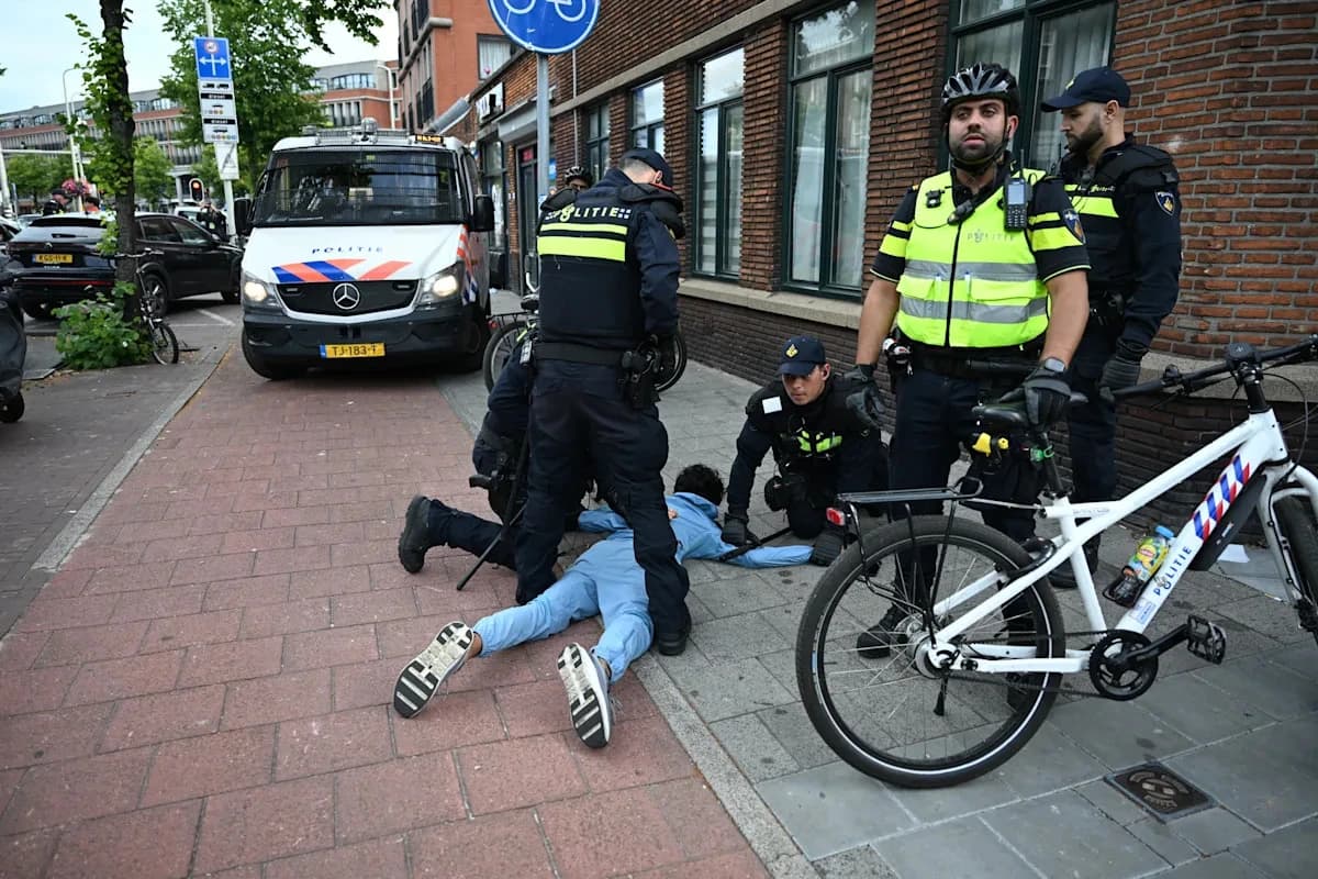Soccer fans clash with police in The Hague after Morocco stuns the Netherlands at the World Cup