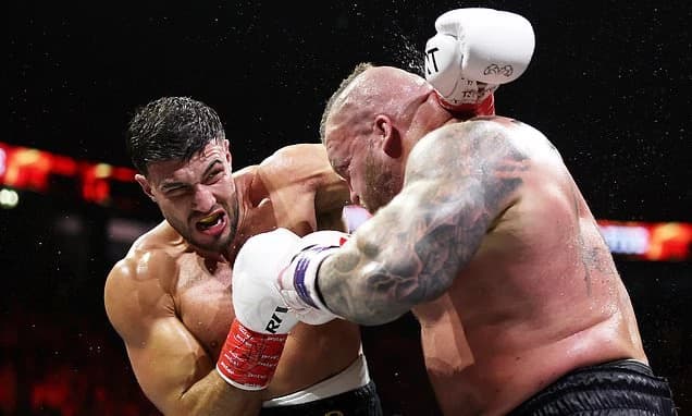 Tommy Fury beats strongman Eddie Hall in crossover bout - with Man City star Phil Foden watching on
