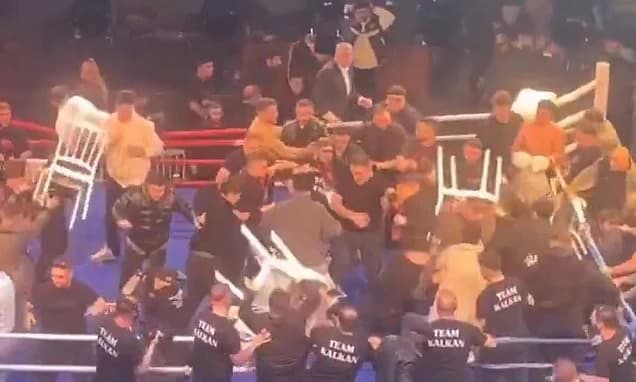 World championship boxing fight descends into huge brawl when the Russian fighter's coach appears to