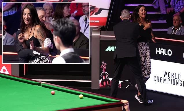 World Snooker Championship final halted as protester complains about BBC licence fee